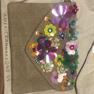 America and Beyond floral jute cross body purse